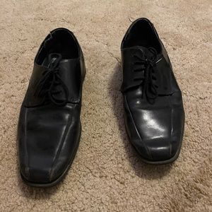 Black leather dress shoes. Well worn